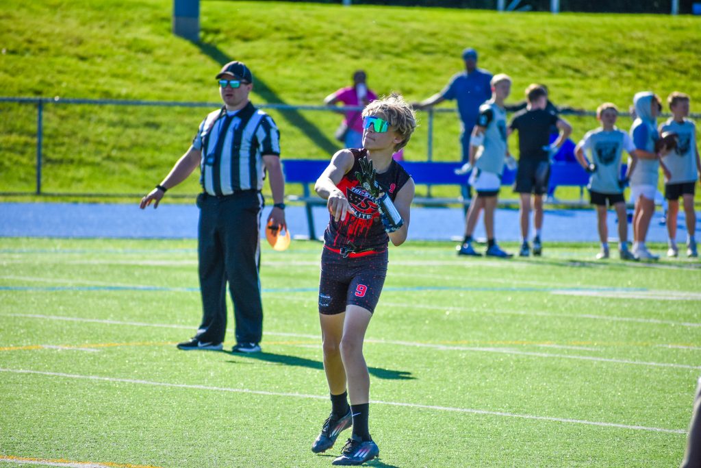 CJ Jackson throwing a football
